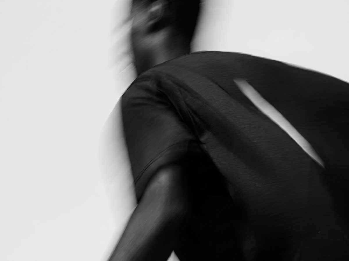 Wild Morph — motion study of a figure in black sportswear