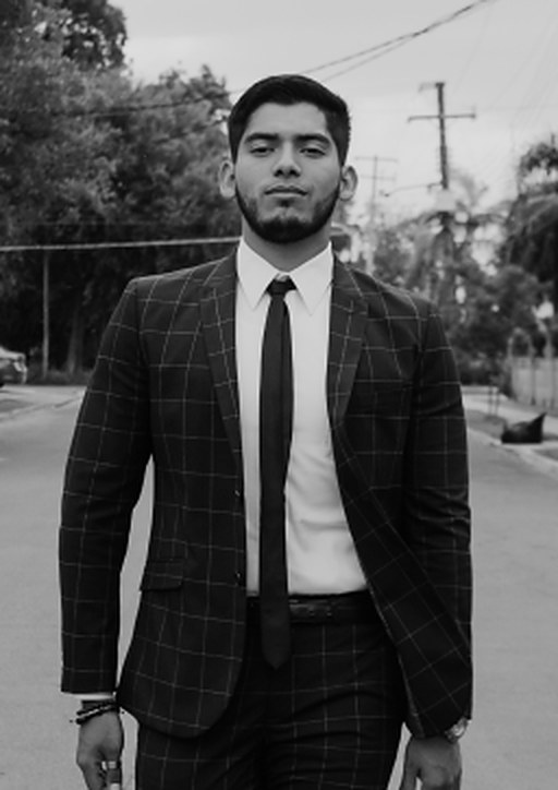 Elias Navarro in a checked suit outside the courthouse