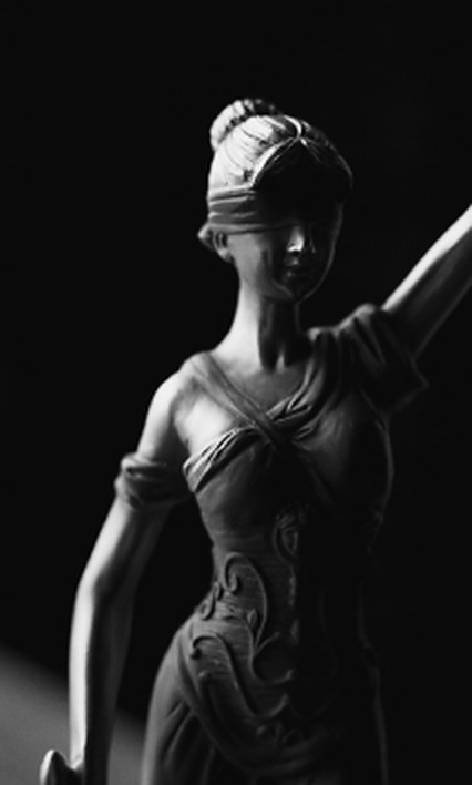 Sculpture of Lady Justice holding the scales